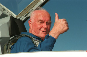 John Glenn gives a thumbs-up in the cockpit of an astronaut training ...