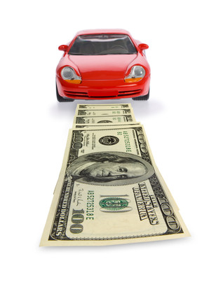Car with cash in front of it Finding Car Insurance Quotes In Michigan