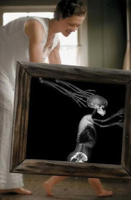 ... picture of a mother playing with her child, with a creepy x-ray frame
