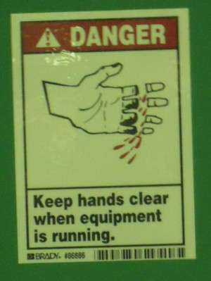 Danger. Keep hands clear when equipment is running.”