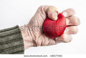 Human fist squeezing red stress ball. Symbol of anxiety, frustration ...