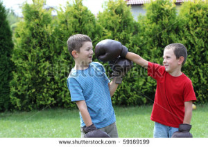 ... child-fighting-with-boxing-gloves-sibling-two-boys-boxing-59169199.jpg