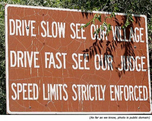 sign: A funny town sign saying: Drive slow see our village! Drive fast ...