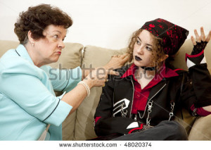 ... mother pointing the finger at her rebellious teenage daughter