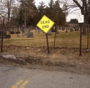 ... of a dead end sign located both at the end of a road and also in