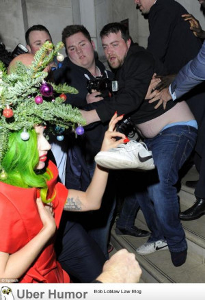 Lady gaga dressed as Christmas tree stealing shoe from fat man