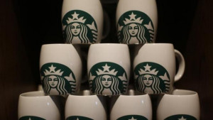 Starbucks coffee mugs are seen on display during the launch of the ...