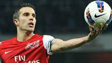 Arsenal's Robin van Persie catches the ball during their English ...
