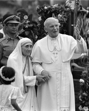 Pope John Paul II holds hands with Mother Teresa after visiting the ...