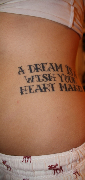Wonderful Black Ink Quote Tattoo On Lowerback