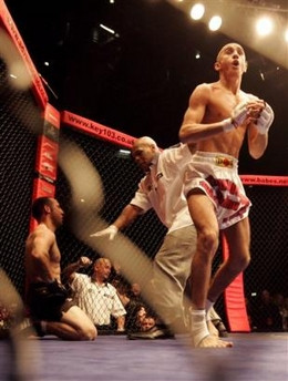 ... In Action As Referee At World Cage Fighting Championship Pictures/Vid