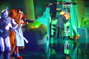 ... curtain, followed by Dorothy, who pulls back the curtain to expose the