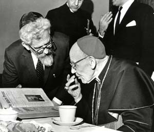 Card. Bea confers with Rabbi Heschel at the Council