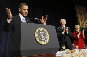 President Obama (L-R) is applauded by Vice President Biden and ...