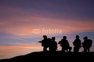 Photo: Silhouette of modern troops in Middle East silhouette