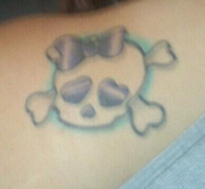 ... is my Girly skull with crossbones tat it resembles the emo kid