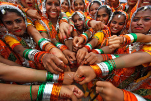 Girls show off their bangles in the colours of the national flag ...