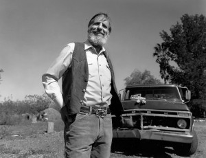 ed abbey in front of his ford pickup truck