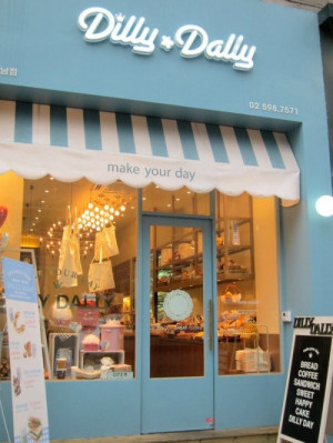 This is a cute bakery front but I like the idea of a striped awning ...