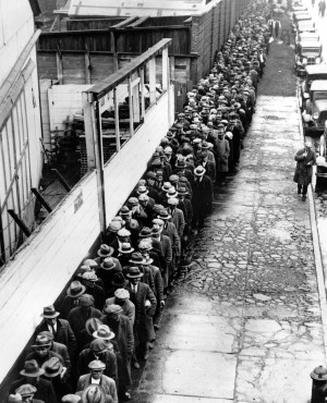 The Associated Press In this 1932 file photo, long line of jobless and ...