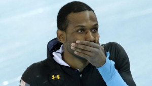 Shani Davis of the U.S. covers his mouth after competing in the men's ...