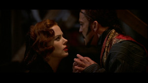 in a theater of the style of the framing segments of Moulin Rouge ...