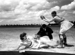 ... League player Marg Callaghan sliding into home plate - April 22, 1948