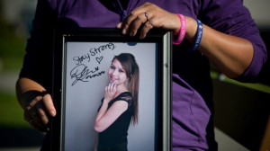 Carol Todd holds a photograph of her late daughter Amanda Todd signed ...