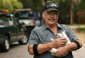 Tow truck driver Steven Ray Allen on Wednesday holds a stray he feeds ...