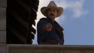 Monte ( Tom Selleck ) takes aim with his Colt 1873 Single Action Army ...
