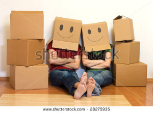 Happy couple in their new home having fun - moving concept - stock ...
