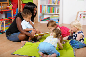 Teacher reading to nursery school children