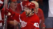 Detroit Red Wings' Darren Helm and fans celebrate his goal against the ...