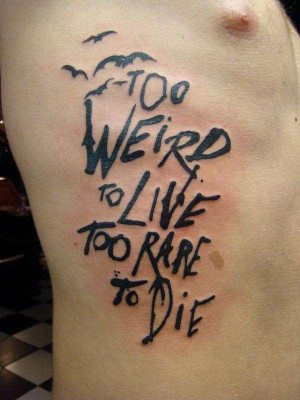 Weird Tattoo on ribcage for guys