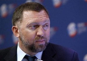 Russian tycoon Oleg Deripaska takes part in a discussion meeting at ...