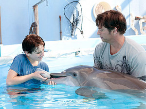 ... left) and Harry Connick Jr. join Winter in a scene from Dolphin Tale