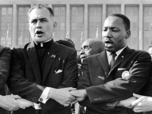 ... activist Theodore Hesburgh photographed with Martin Luther King Jr