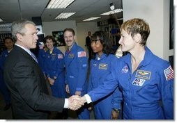 President George W. Bush greets shuttle astronauts from right, Peggy ...