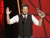 Blake Shelton accepts the award for entertainer of the year at the ...