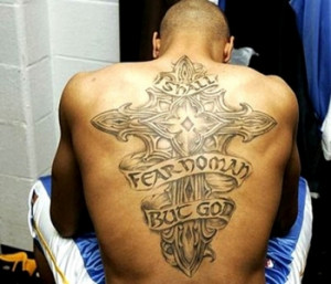 The Tattoo on his back reads, 
