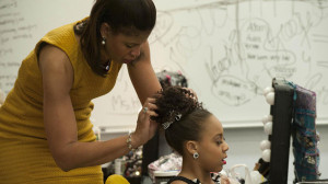 Holly is doing Nia's hair before she goes on stage in Dance Moms