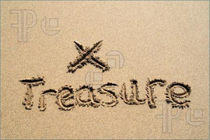 ... word treasure written in the sand with an X marking the spot to dig