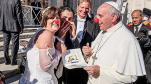 See Pope Francis Clown Around With Newlywed Couple