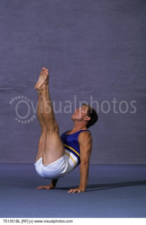 Male Gymnast Performing The
