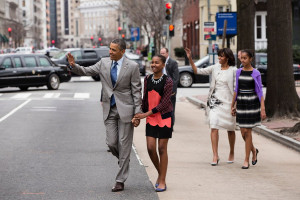 President Barack Obama and First Lady Michelle Obama walk with their ...