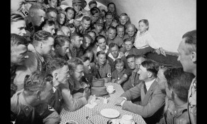 propaganda photograph showing Hitler speaking to followers in the ...