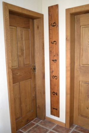 Turn a 2x4 into a large ruler for the wall, and record the height of ...
