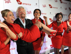 22 April 2013: Virgin Group Founder Sir Richard Branson lifts a Virgin ...