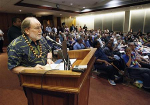 Hawaii Governor Neil Abercrombie reads a quote from the Dalai Lama as ...