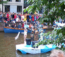 Amsterdam 's pride parade is held in the canals that surround the city